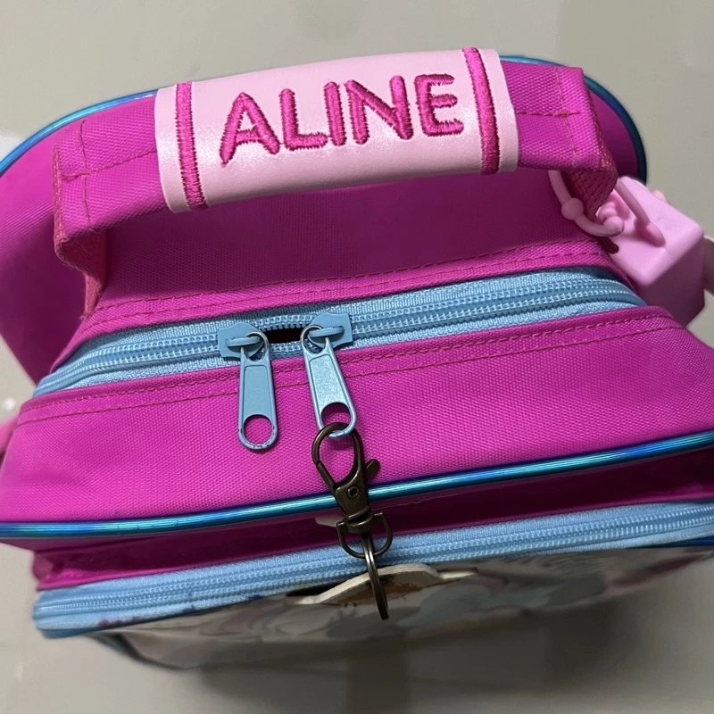 ป้ายหนังปักชื่อคล้องหูกระเป๋า